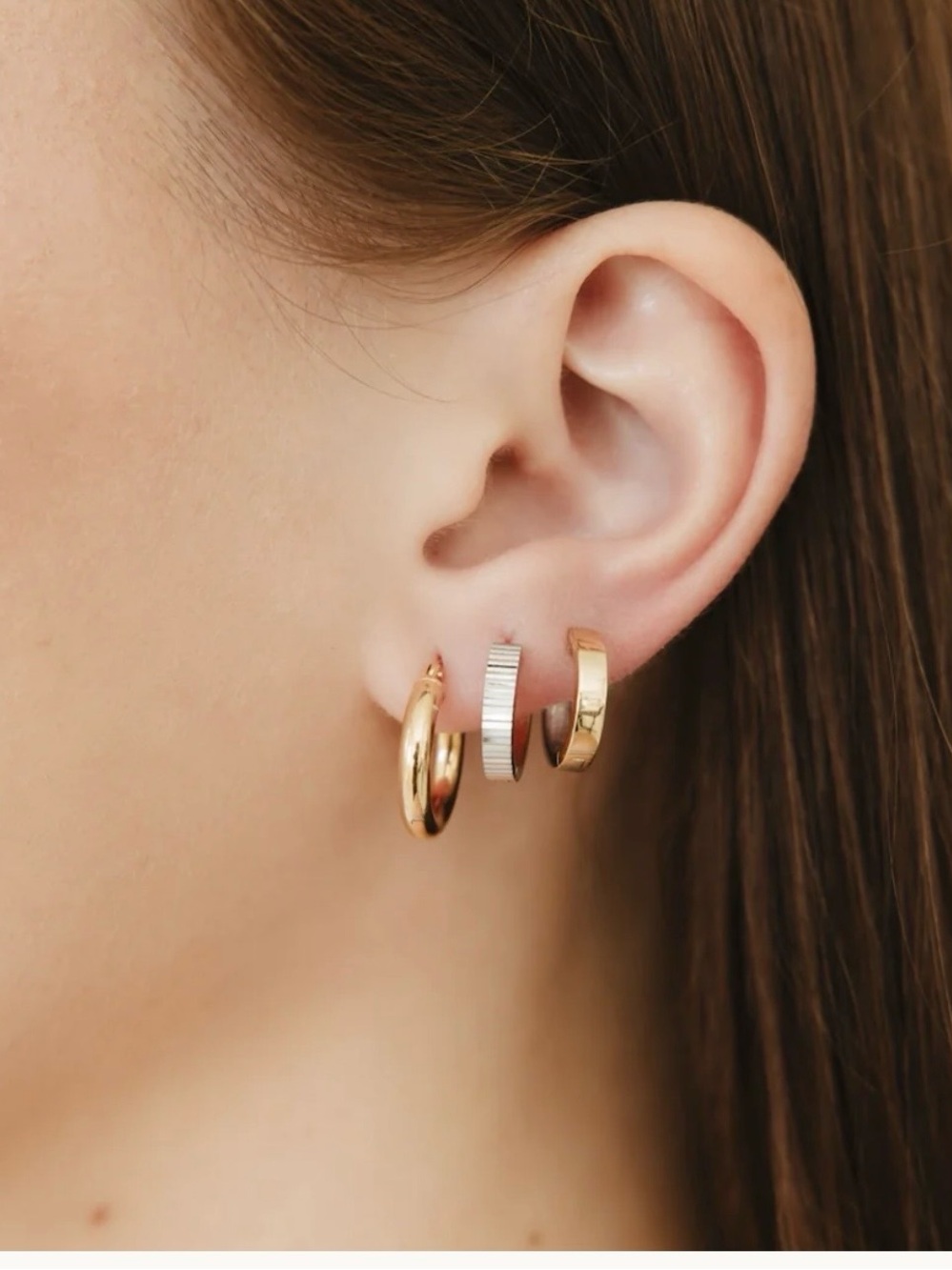 Two-toned 14k yellow and white gold huggie hoops